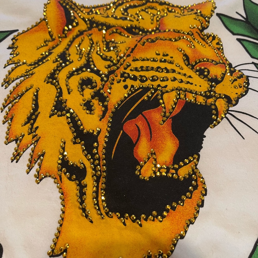 New with tags gold studs on a lions face